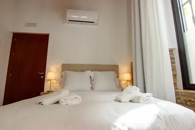 Cama o camas de una habitación en RentalSevilla Lumbreras I