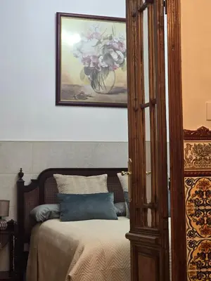 Cama o camas de una habitación en Casa de la Tata la Judería Sevilla