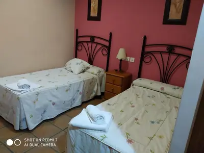 Cama o camas de una habitación en Hostal Restaurante El Parador
