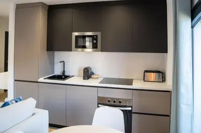 Una cocina o zona de cocina en Apartamentos MLC Ciudad de Linares