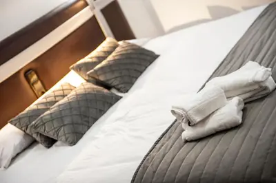 Cama o camas de una habitación en HOSTAL LAS PALOMAS