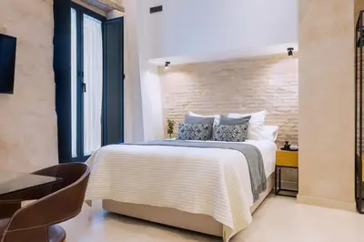 Cama o camas de una habitación en Luxurious studio with Jacuzzi in Casa Pilatos