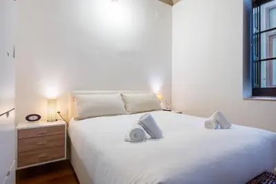 Cama o camas de una habitación en Plaza San Marcos Apartment