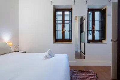 Cama o camas de una habitación en Plaza San Marcos Apartment