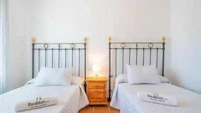 Cama o camas de una habitación en Casa Rural Cayara by Ruralidays