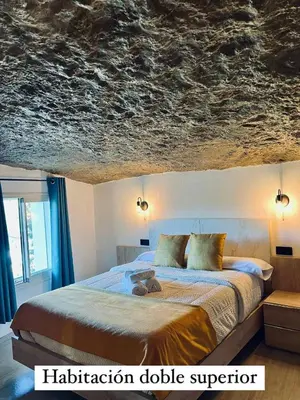 Cama o camas de una habitación en Cueva Luxe Las Calcetas