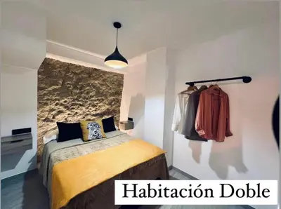 Cama o camas de una habitación en Cueva Luxe Las Calcetas