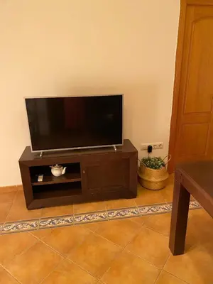 Una televisión o centro de entretenimiento en Apartamento Puerta del Perdón