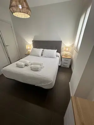 Cama o camas de una habitación en Coello31 - Apartamento céntrico y tranquilo, con piscina y parking