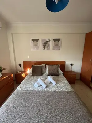 Cama o camas de una habitación en Cozy apartment next to center