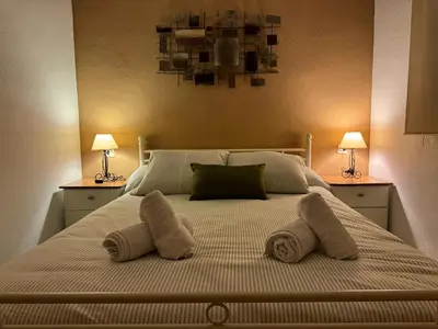Cama o camas de una habitación en Apartamento Gran Vía Parque 7