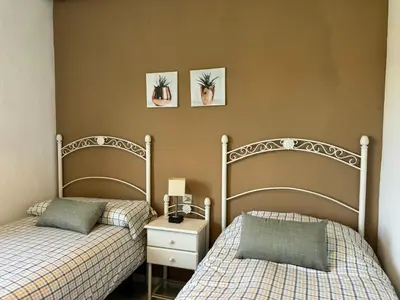 Cama o camas de una habitación en Apartamento Gran Vía Parque 7