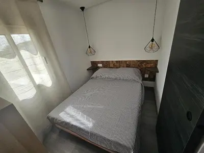 Cama o camas de una habitación en Piso Ana appartement Cosy et moderne, Climatisé été, hiver