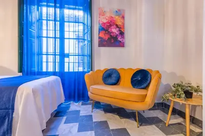 Cama o camas de una habitación en AL-QUIVIR Suites