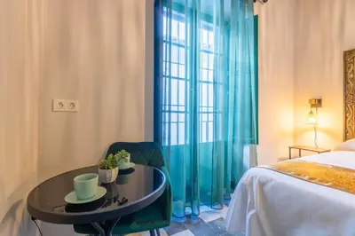 Cama o camas de una habitación en AL-QUIVIR Suites