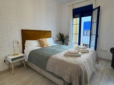 Cama o camas de una habitación en El Rincón del Azahar, dúplex con encanto