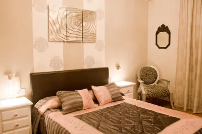 Cama o camas de una habitación en Hostal Hispalis