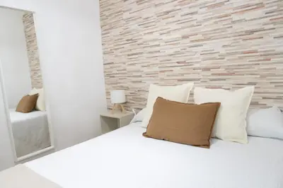 Cama o camas de una habitación en La casita de elle