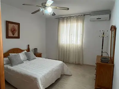 Cama o camas de una habitación en CH Apartamentos Luque
