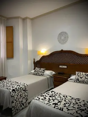 Cama o camas de una habitación en Hotel Los Omeyas