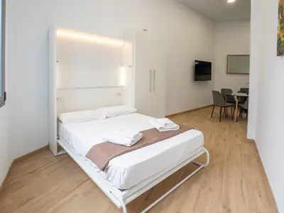 Cama o camas de una habitación en Apartamentos La Fuensanta