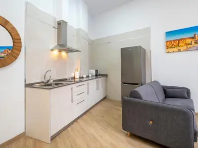Una cocina o zona de cocina en Apartamentos La Fuensanta