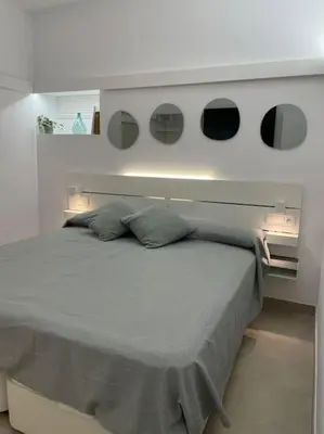 Cama o camas de una habitación en Apartamento Hoomtur Sevilla
