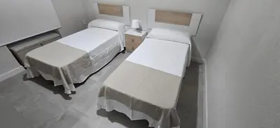 Cama o camas de una habitación en El balcón del puente romano