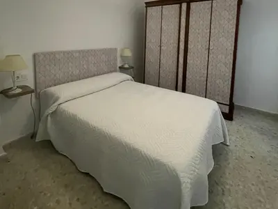 Cama o camas de una habitación en Alojamiento Comercio.