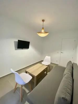 Una televisión o centro de entretenimiento en 9762 Apartamento Corte