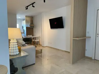 Una televisión o centro de entretenimiento en Apartamento Las Teresas Khalifa
