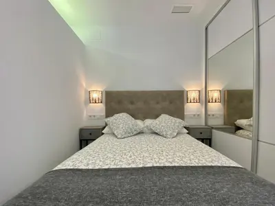 Cama o camas de una habitación en APARTAMENTOS FIBES GARDEN SEVILLA