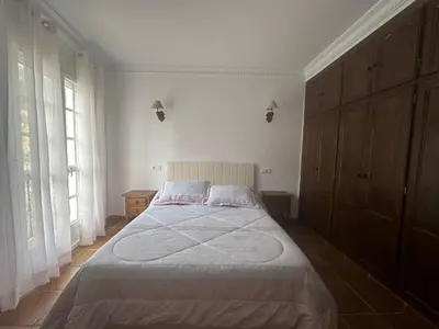 Cama o camas de una habitación en La casita del Cabaña