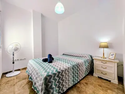 Cama o camas de una habitación en Alojamiento La Palmera