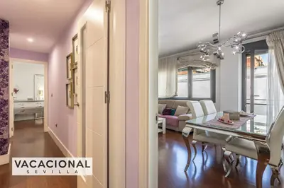 Cama o camas de una habitación en Ilusion Sevilla