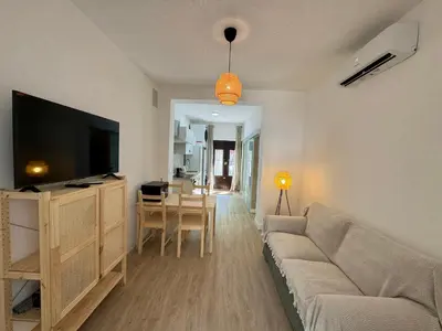 Una televisión o centro de entretenimiento en Apartamento Búho - Junto al Castillo