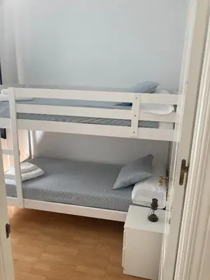 Cama o camas de una habitación en Rialto céntrico patio sevillano