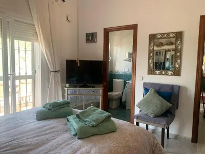Una televisión o centro de entretenimiento en Casa San Jose