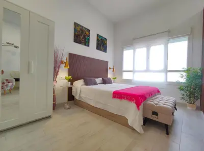 Cama o camas de una habitación en The Urban Elegance Suite
