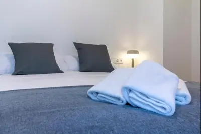 Cama o camas de una habitación en Alohamundi Puerta Osario II