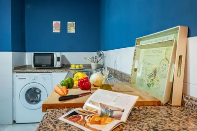 Una cocina o zona de cocina en Charming 2 Bedroom Boutique Triplex Apartment with Private Terrace at Seville City Center by OCityzen