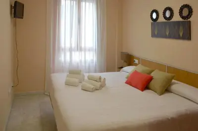 Cama o camas de una habitación en Casa Patio las Palmeras Córdoba con piscina