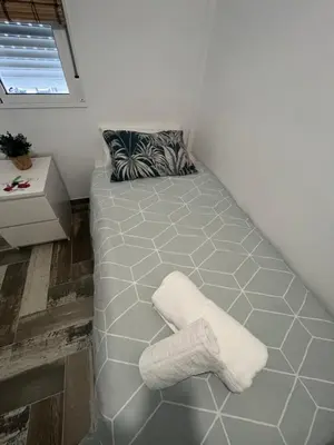 Cama o camas de una habitación en Lovely Rooms en piso compartido