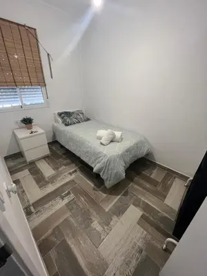 Cama o camas de una habitación en Lovely Rooms en piso compartido