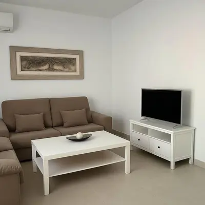 Una televisión o centro de entretenimiento en Alojamiento Baeza California 2A