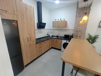 Una cocina o zona de cocina en Apartamento moderno junto a estación de tren