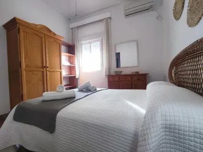Cama o camas de una habitación en Apartamento Turístico Córdoba Centro Jardín