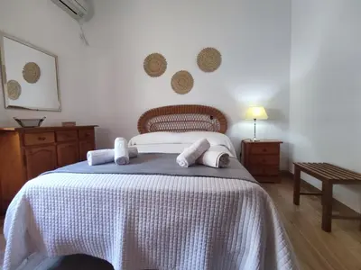 Cama o camas de una habitación en Apartamento Turístico Córdoba Centro Jardín