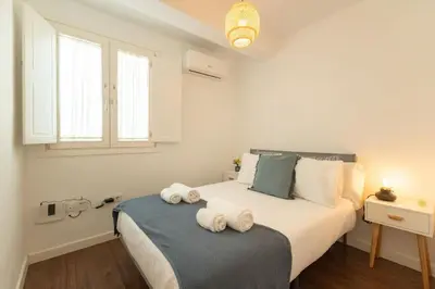 Cama o camas de una habitación en Alhondiga Central Suite By Valcambre
