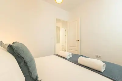 Cama o camas de una habitación en Alhondiga Central Suite By Valcambre